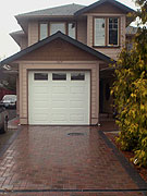 Shiny driveway made from stone pavers