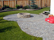 Brick Patio with stone fire pit